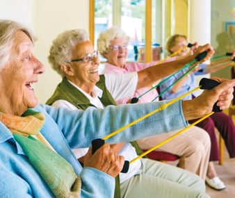 Elderly residents taking part in a group activity 
