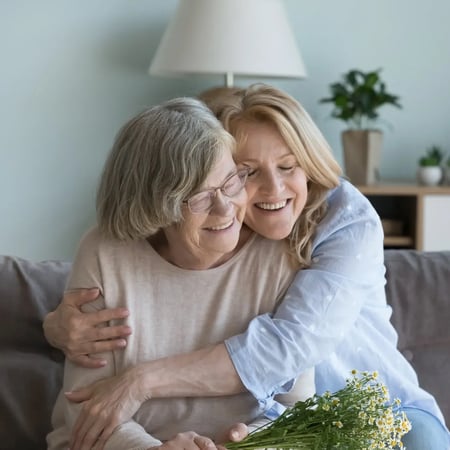 Woman visiting elderly mother 1x1