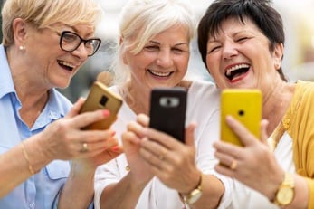 group of seniors using resident engagement app