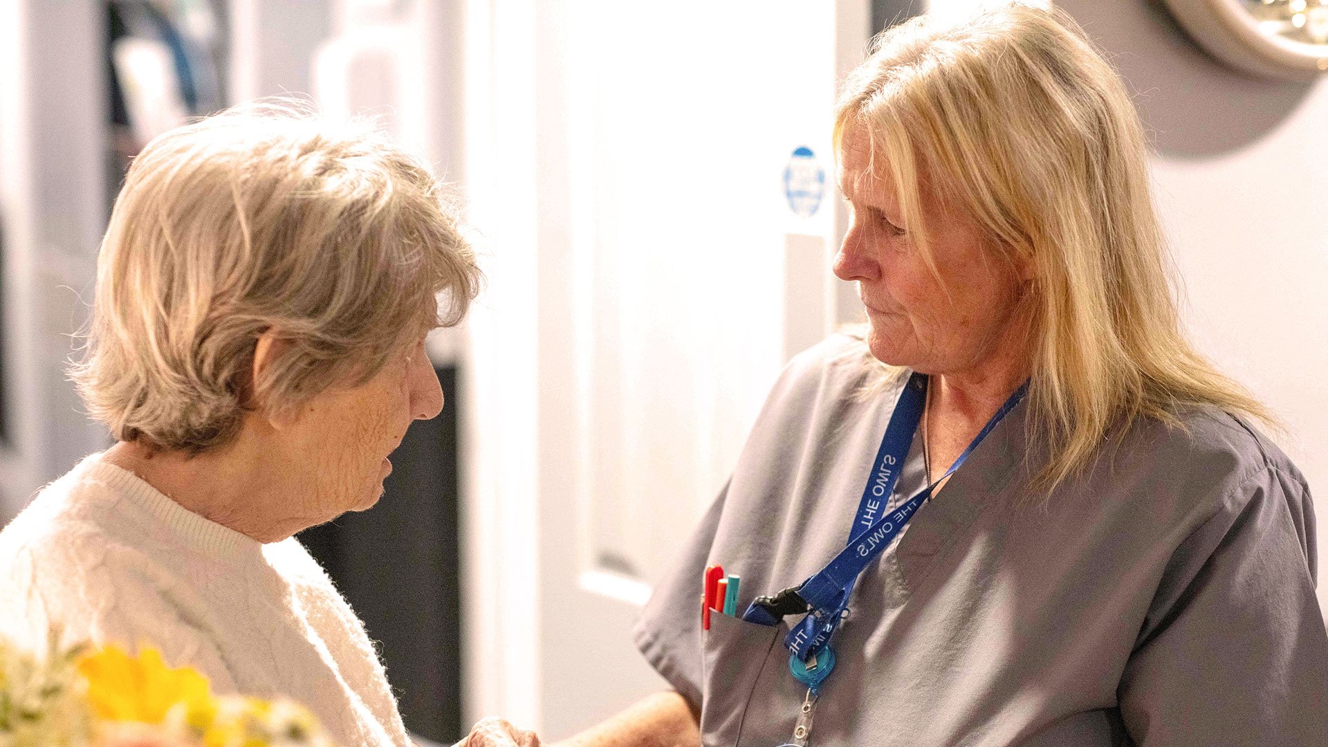 Kim talk to a resident at Beechy Knoll Care Home