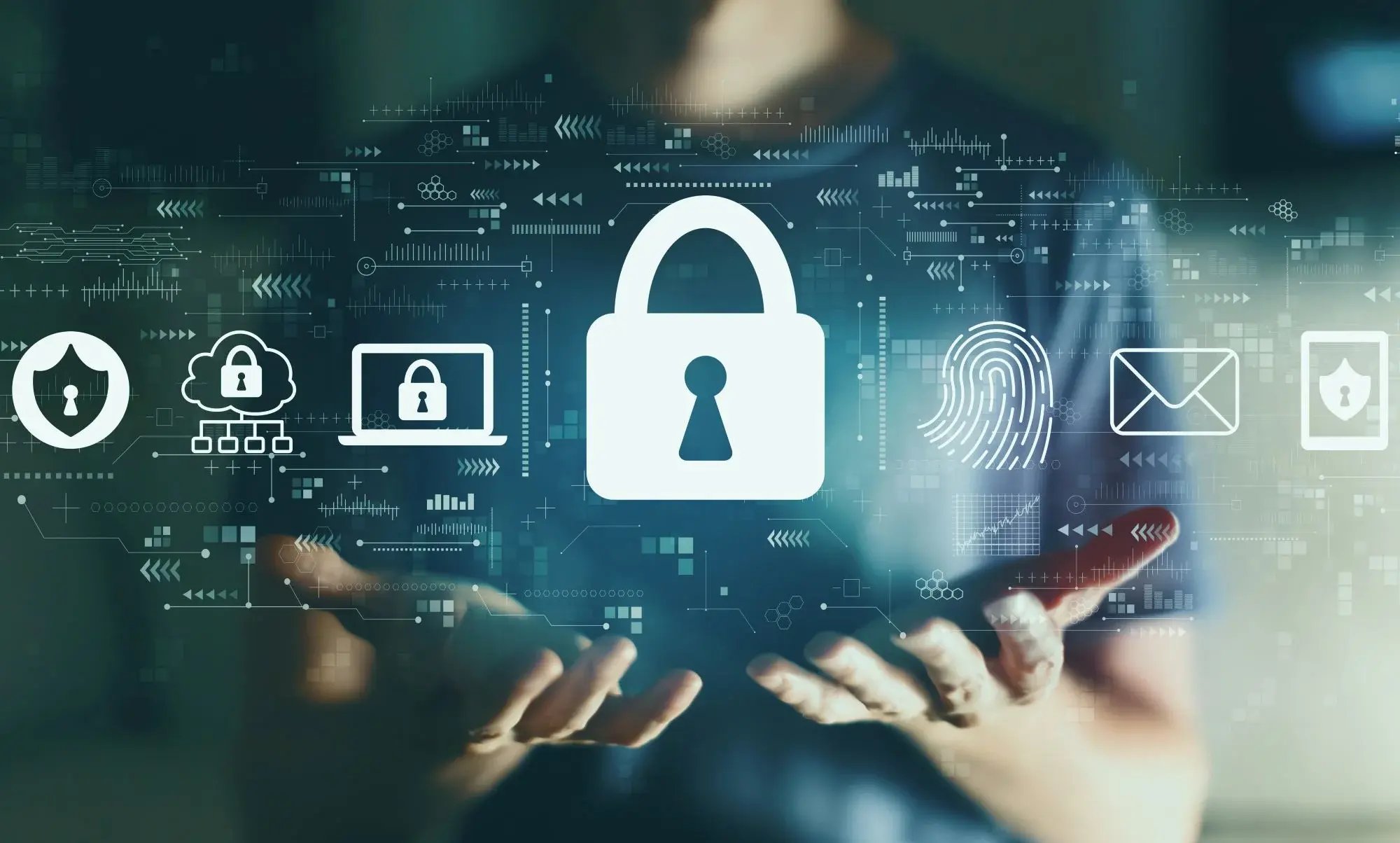 A person's open hands with graphics floating above showing a padlock, shields and laptop