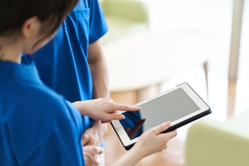 How many care staff per resident are required in UK care homes?