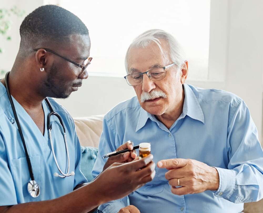 Nurse giving medication to a resident 