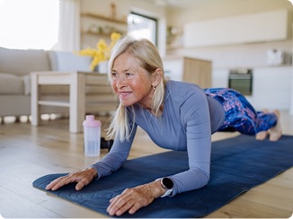 An older woman doing a balance and core strength exercise.